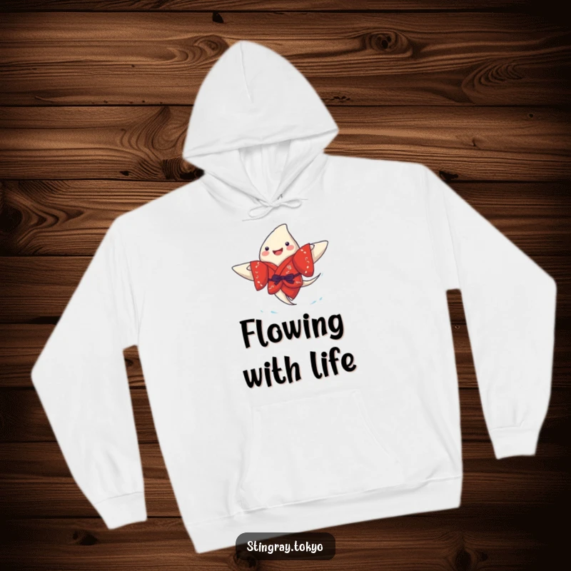 Funny stingray hoodie depicting a joyful sea creature in a red kimono, paddling merrily, providing warmth and underwater-themed charm.
